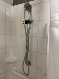 Silly little hand held, small shower head with no pressure