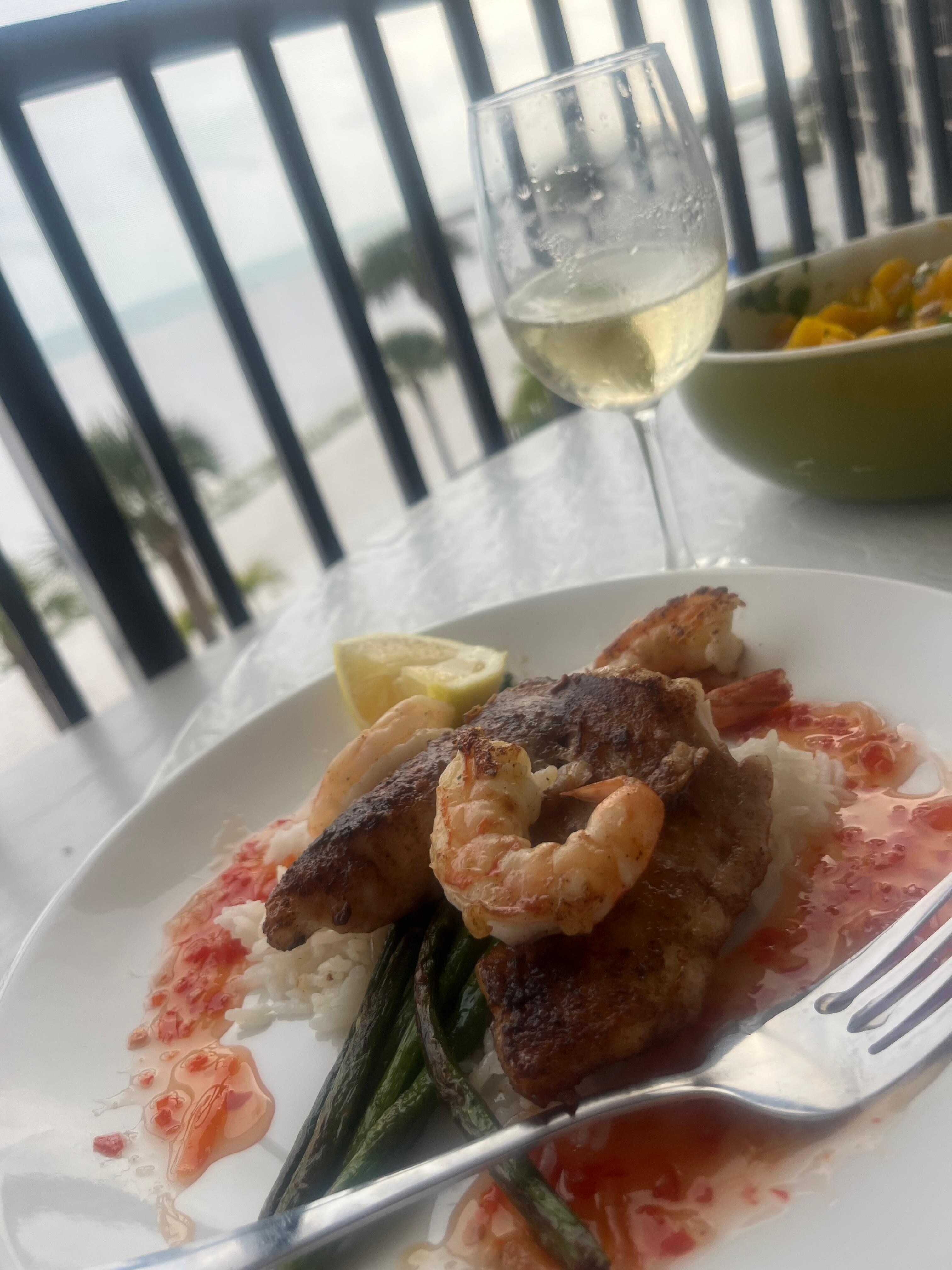 Delicious coconut rice, shrimp, grouper, & mango salsa