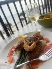 Delicious coconut rice, shrimp, grouper, & mango salsa