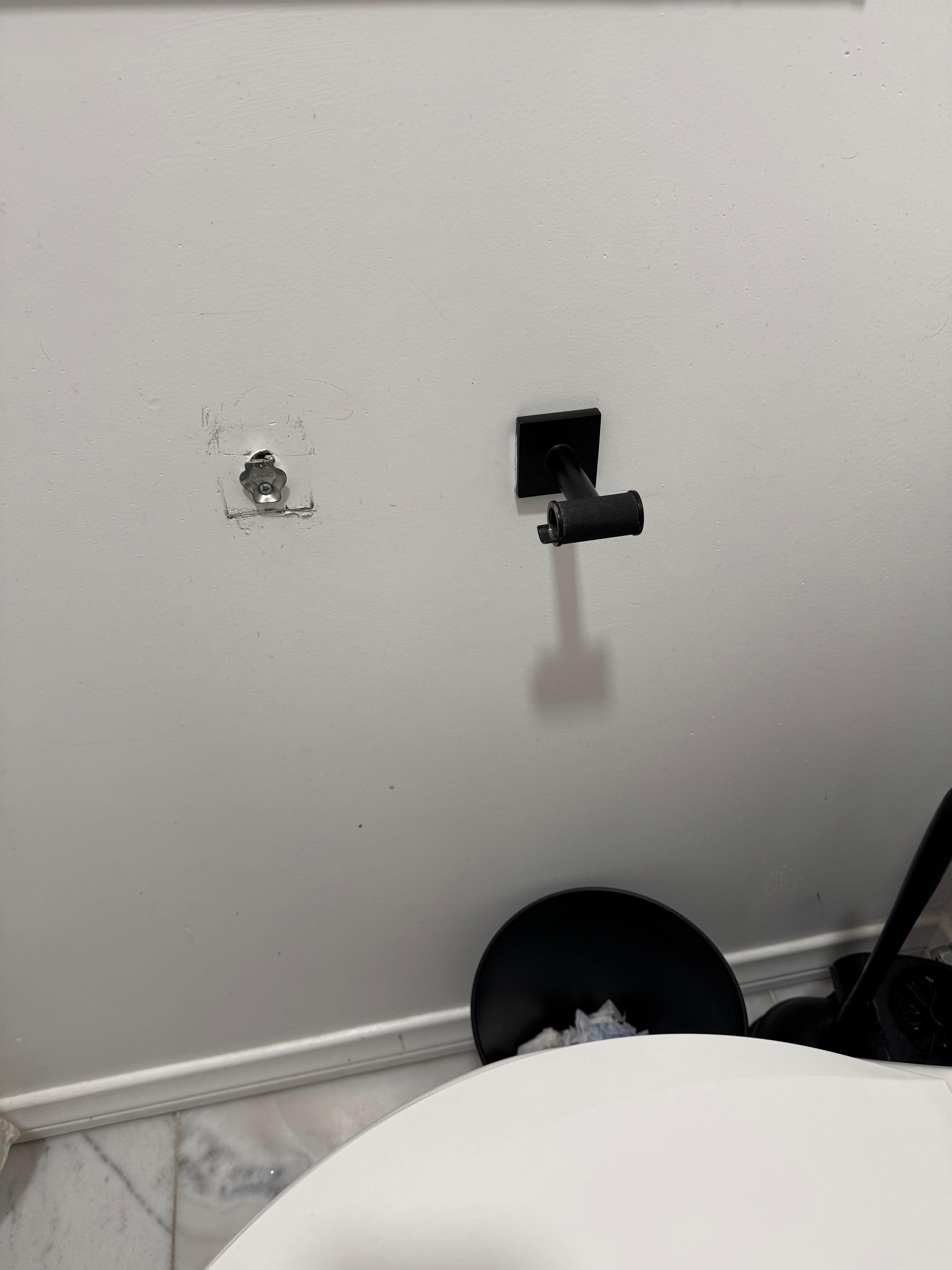 Broken toilet paper holder 