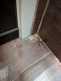 Accumulated dirt in corner.