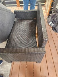 broken couch on porch with TV, no way to sit outside