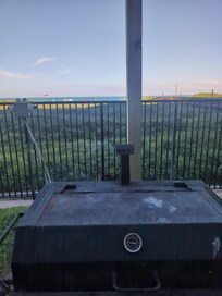 Grill by charcoal on the lawn.