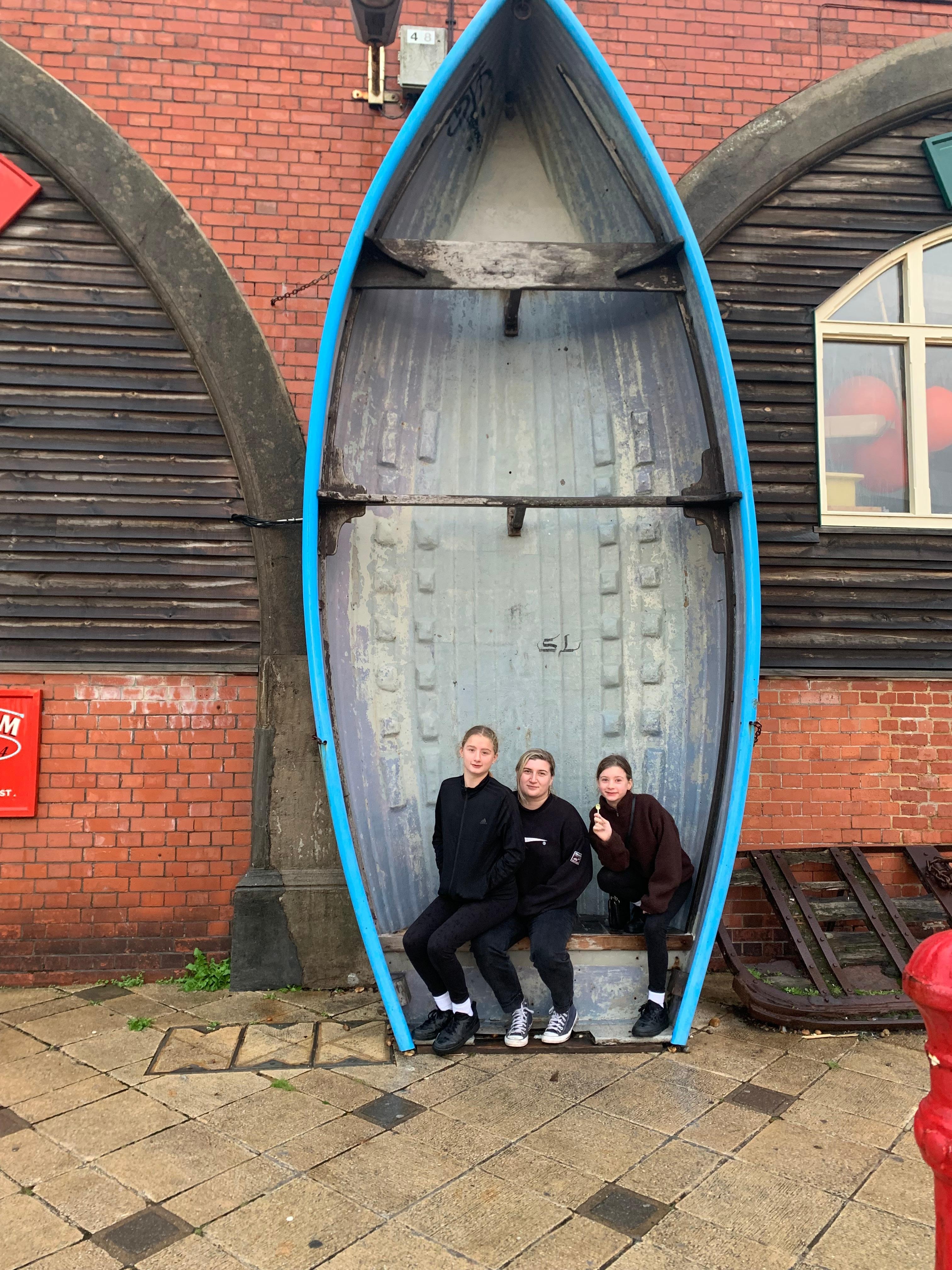 On the beach with there older sister 