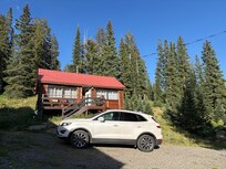 Our cabin. Nice patio with chairs to enjoy scenery.