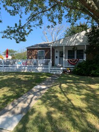Unit A, our rental, similar unit to our right w front porch. 2 in back.