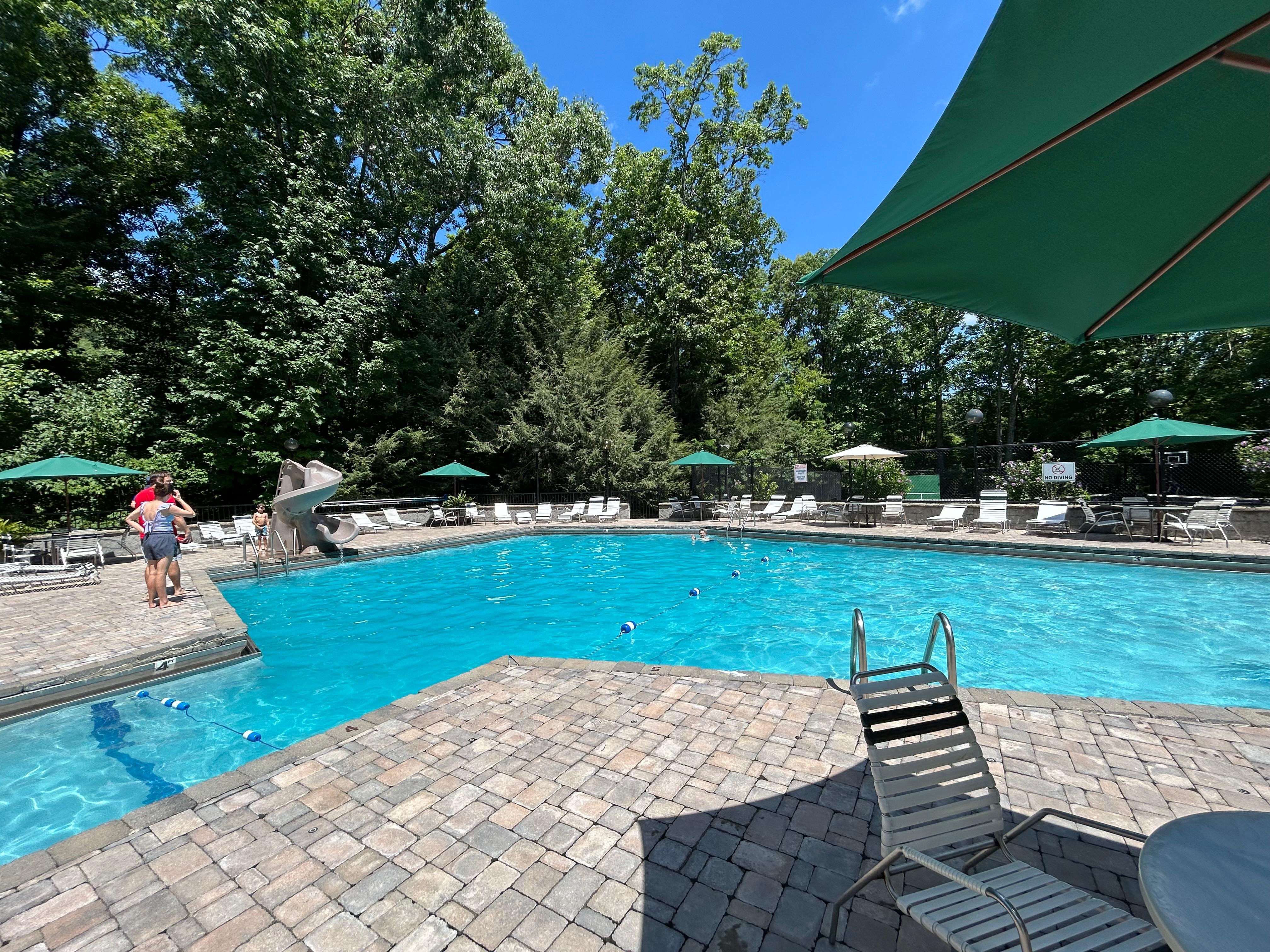 Community pool with tennis courts and basketball 