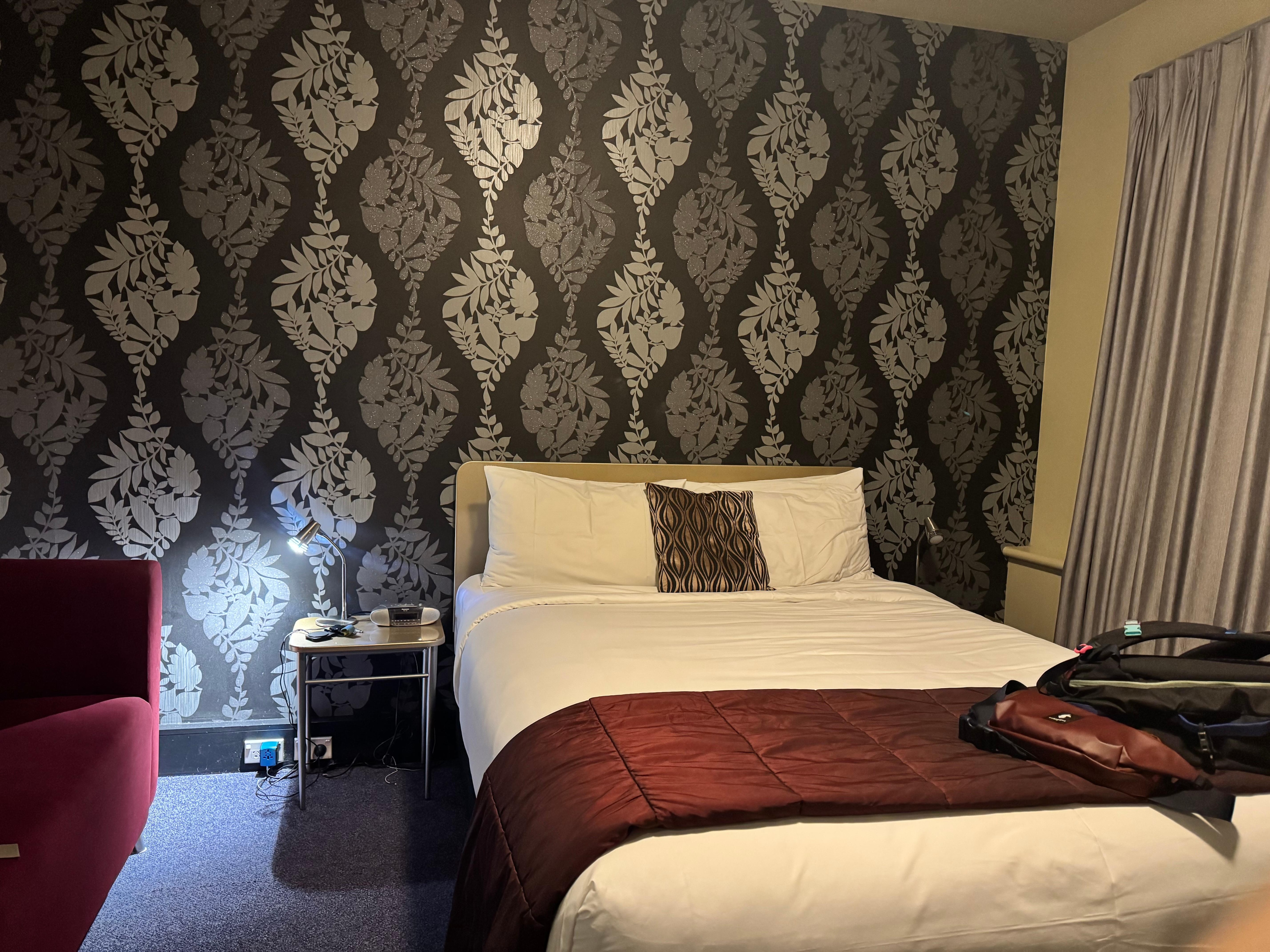 Spacious room with a big desk and sofa 