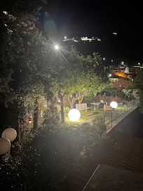 Nite view to cute little garden that was peaceful place to read during day.