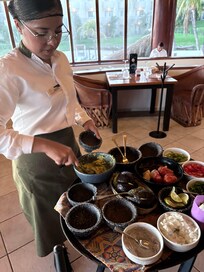 Juliana making guacamole at the table in La Adelita