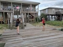 Our girls playing volleyball on the dock