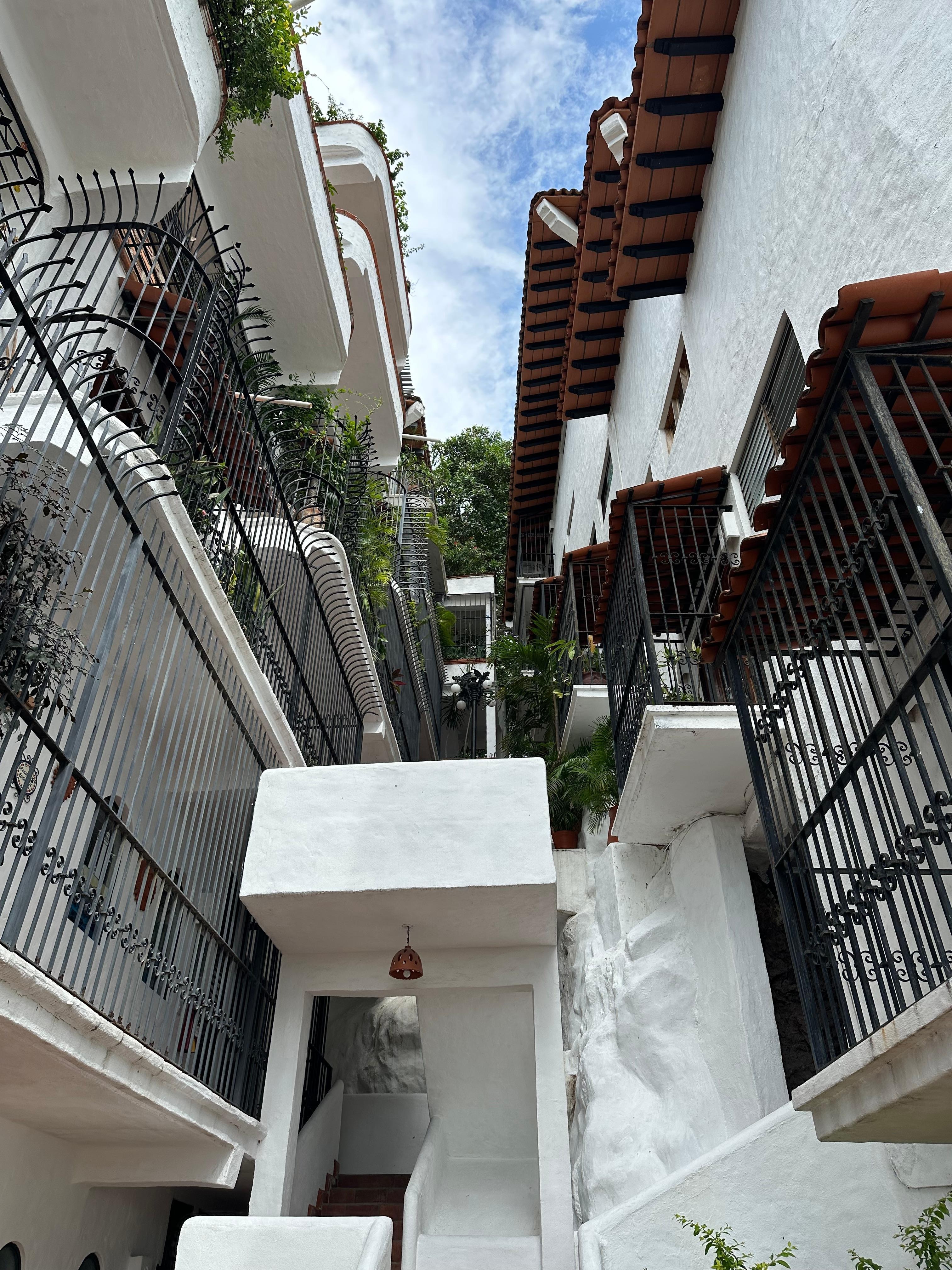 Looking up at the interesting architecture between two of the three buildings.