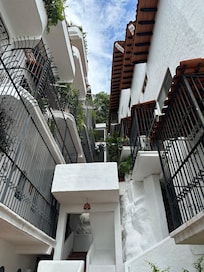 Looking up at the interesting architecture between two of the three buildings.