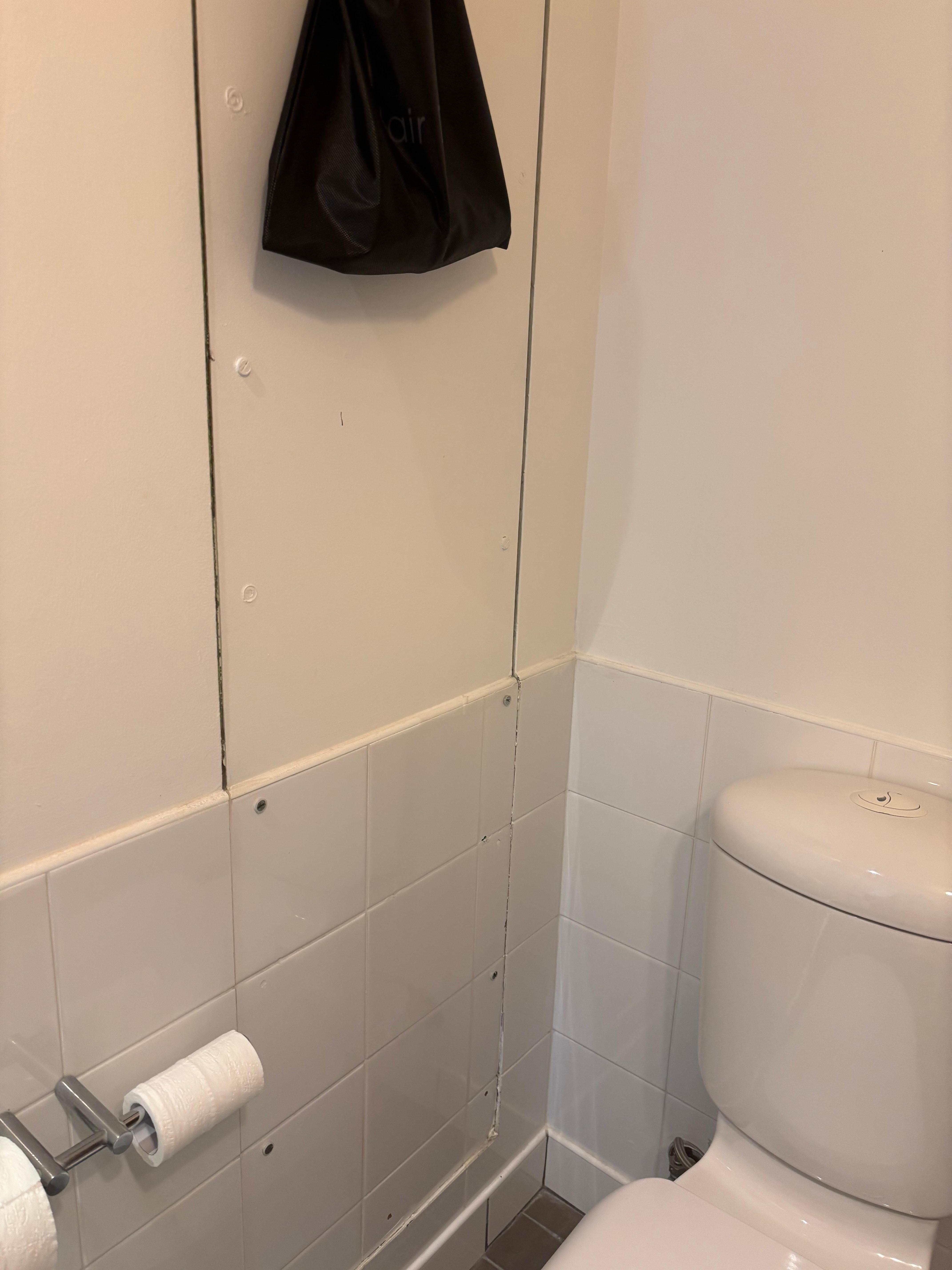 cut out in bathroom walls badly repaired