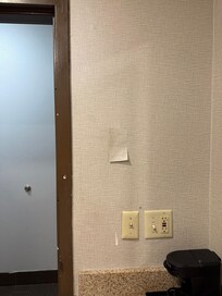 Dirty wall and wallpaper that had a hole in it