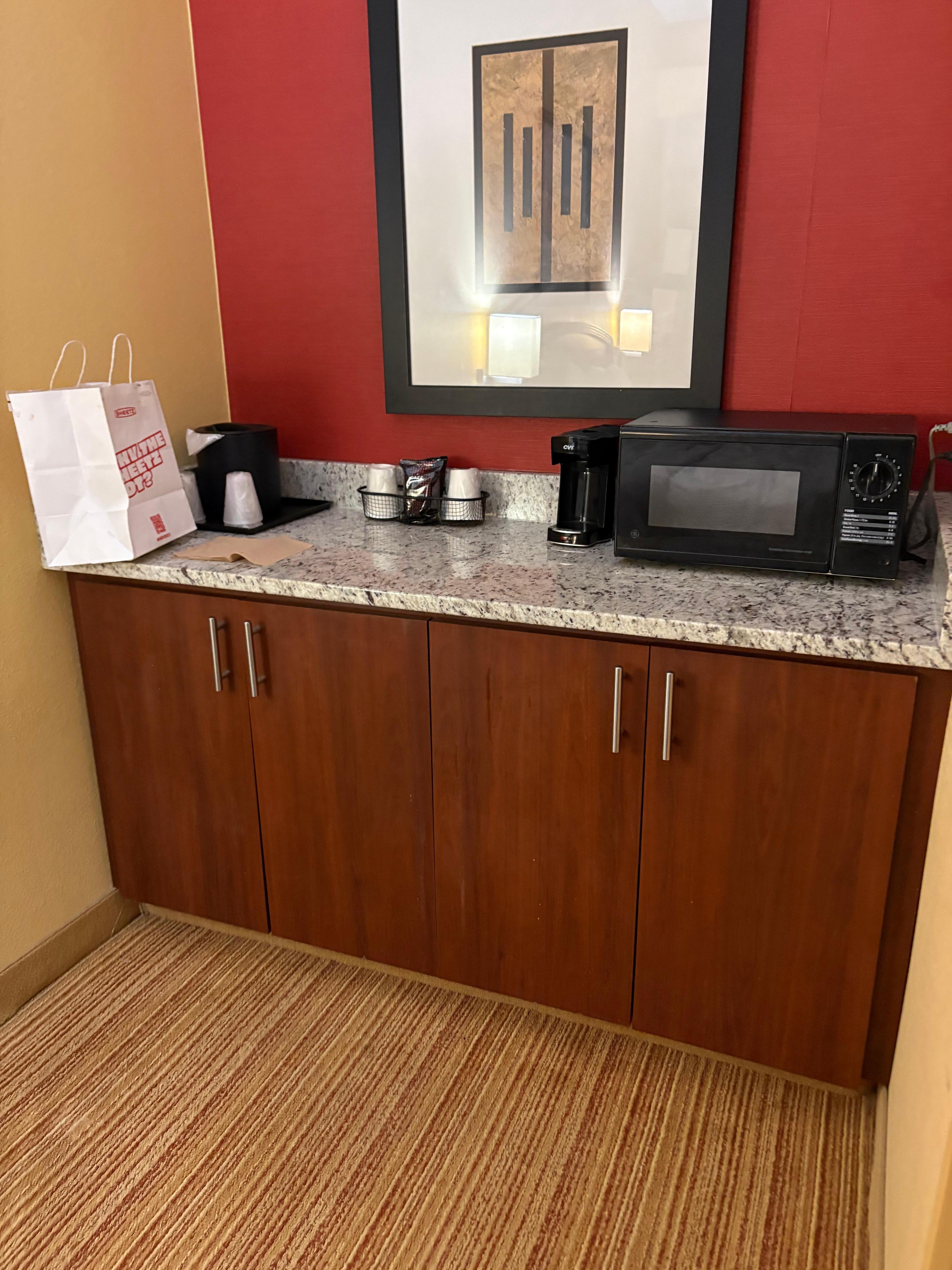 Mini fridge in cabinet, microwave 