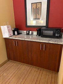 Mini fridge in cabinet, microwave