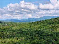 Long range views off the back covered porch during mid day