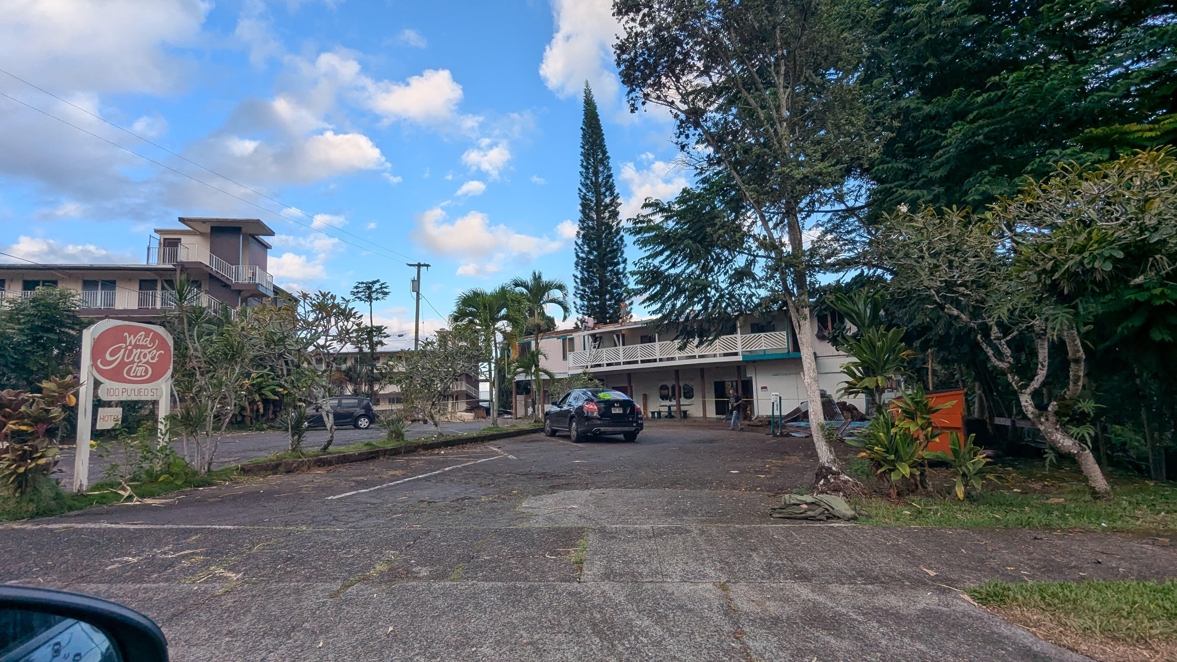 Men are repairing the roof because half of it is gone. 