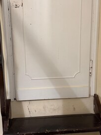 Wooden Stairs down into apartment from foyer (after one easy flight up) upand 1 step down to bathroom