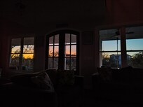 Watching the sunrise from the comfort of the sofa in the living room.