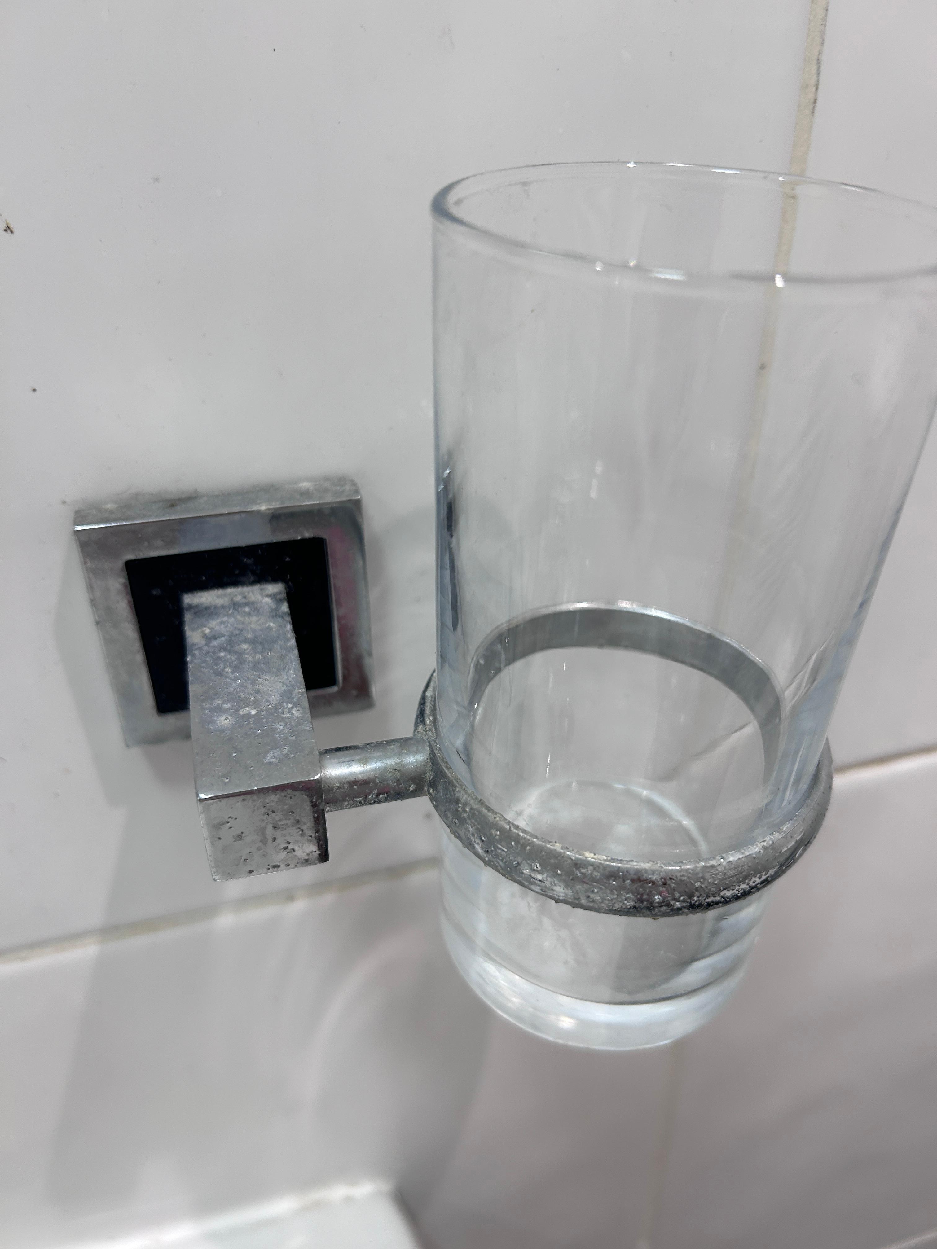 Glass in bathroom dirty and dusty