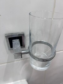 Glass in bathroom dirty and dusty