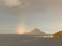 Rainbow near Yacaba headland iin the distance