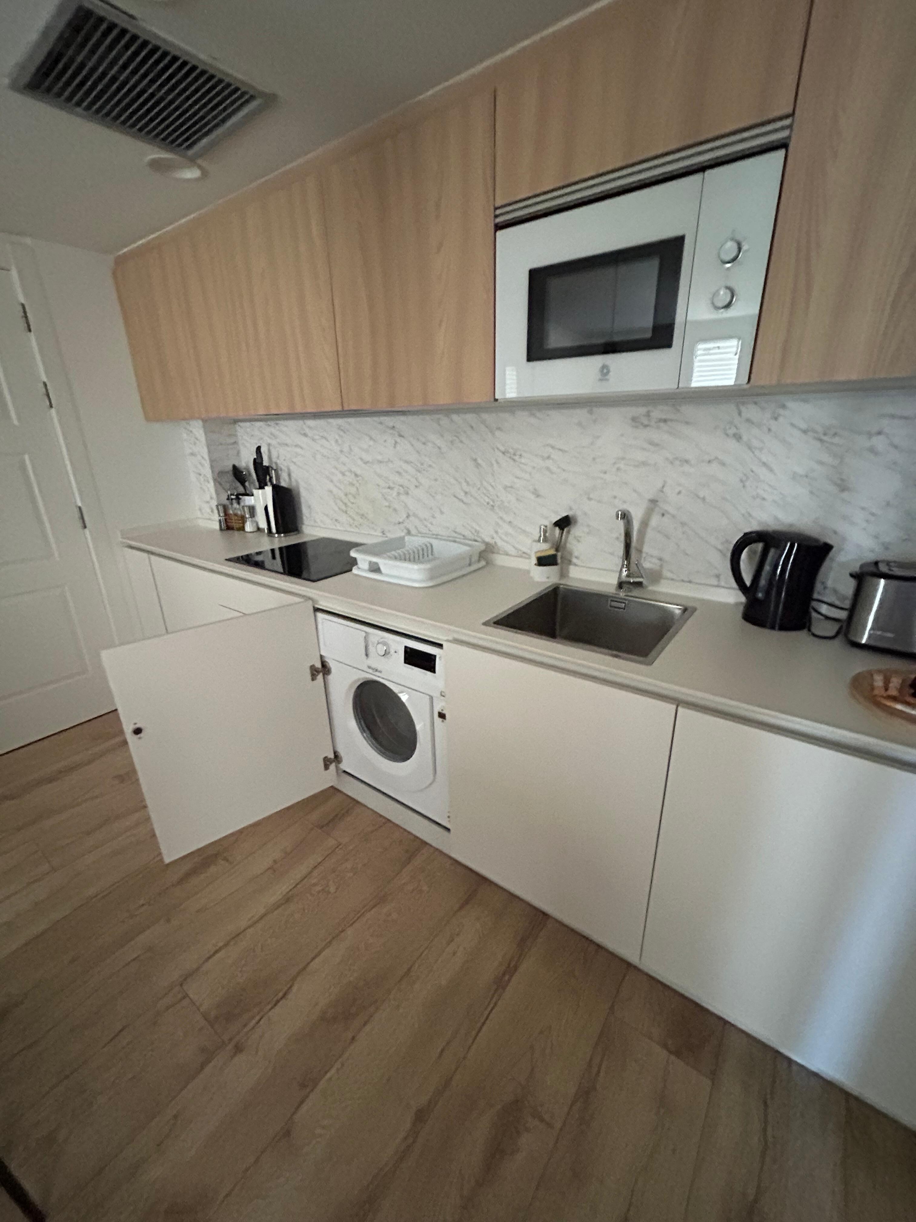 Loves that it had a washing machine and drying rack!