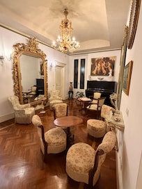 Common area with espresso machine and fridge