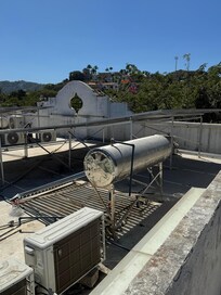 The hot water is solar. During my 4 night stay I never even had a warm shower. I had a room temperature shower. I brought this issue up to the front desk, maintenance and management. Solar only! The HOTELS.COM description does not mention this.