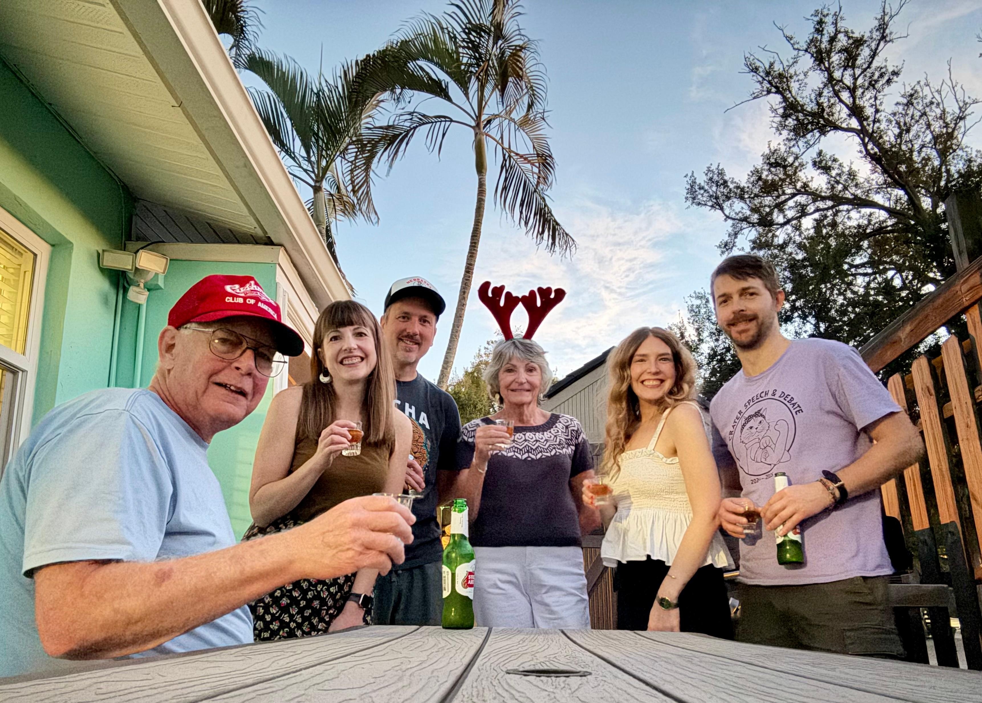 Christmas dinner with our family beside the rental.