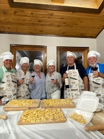 Siblings enjoying annual visit with each other. Pasta making class with our Italian chef, Monica!
