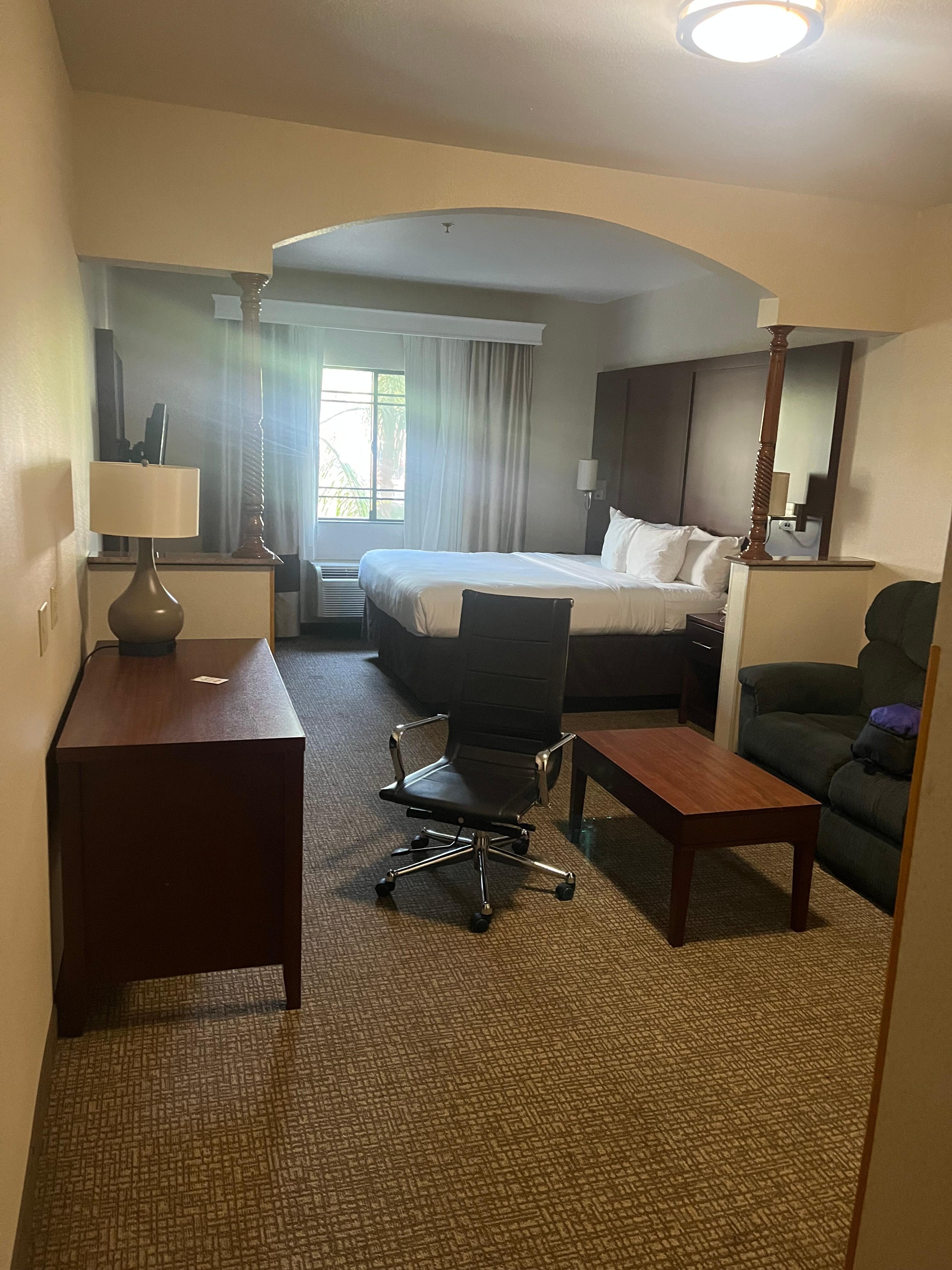 Bed, table, and sofa all for use by the person staying in the room. 