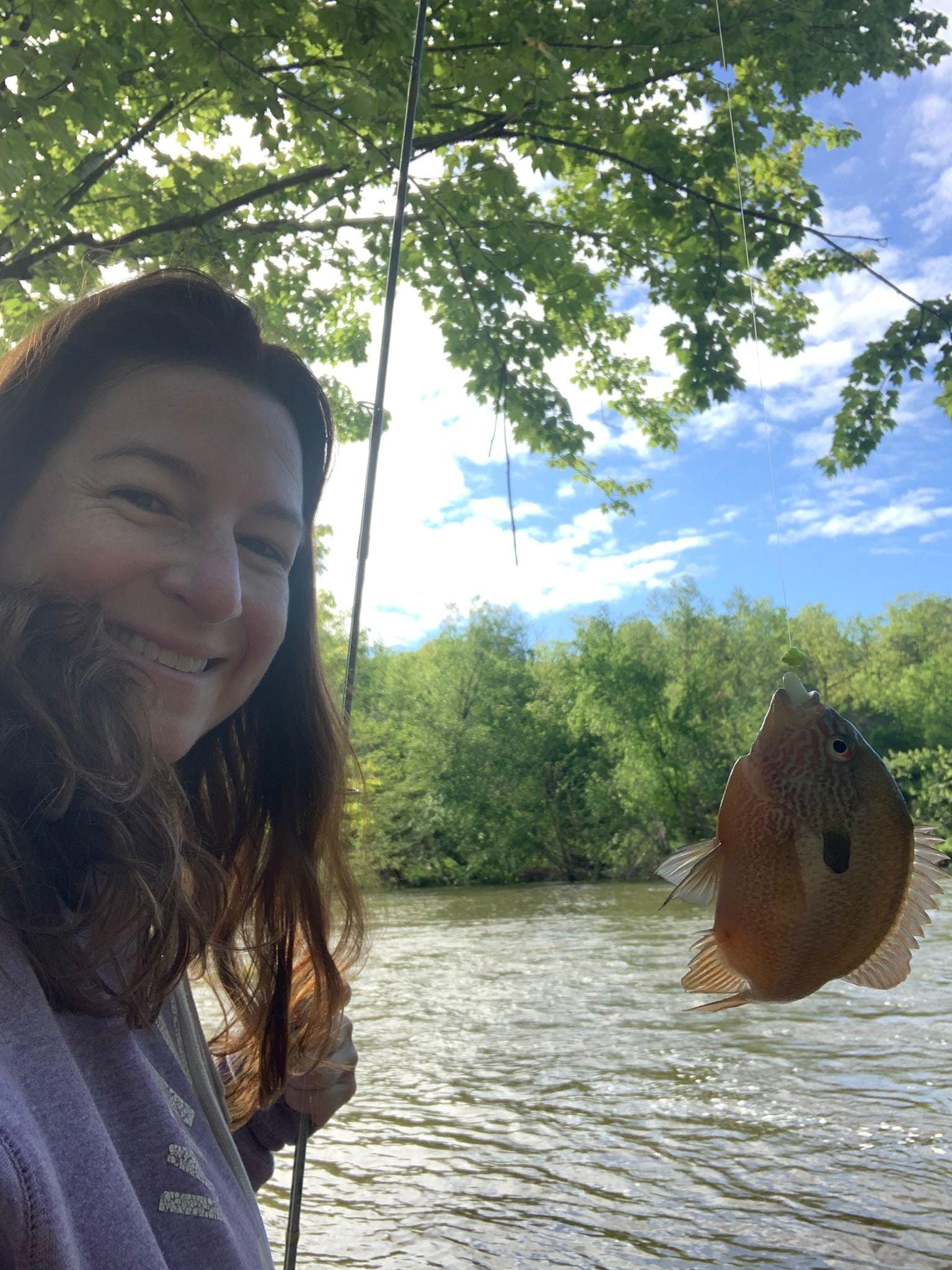 My daughter caught a Sun Fish and promptly returned the fish to the water.