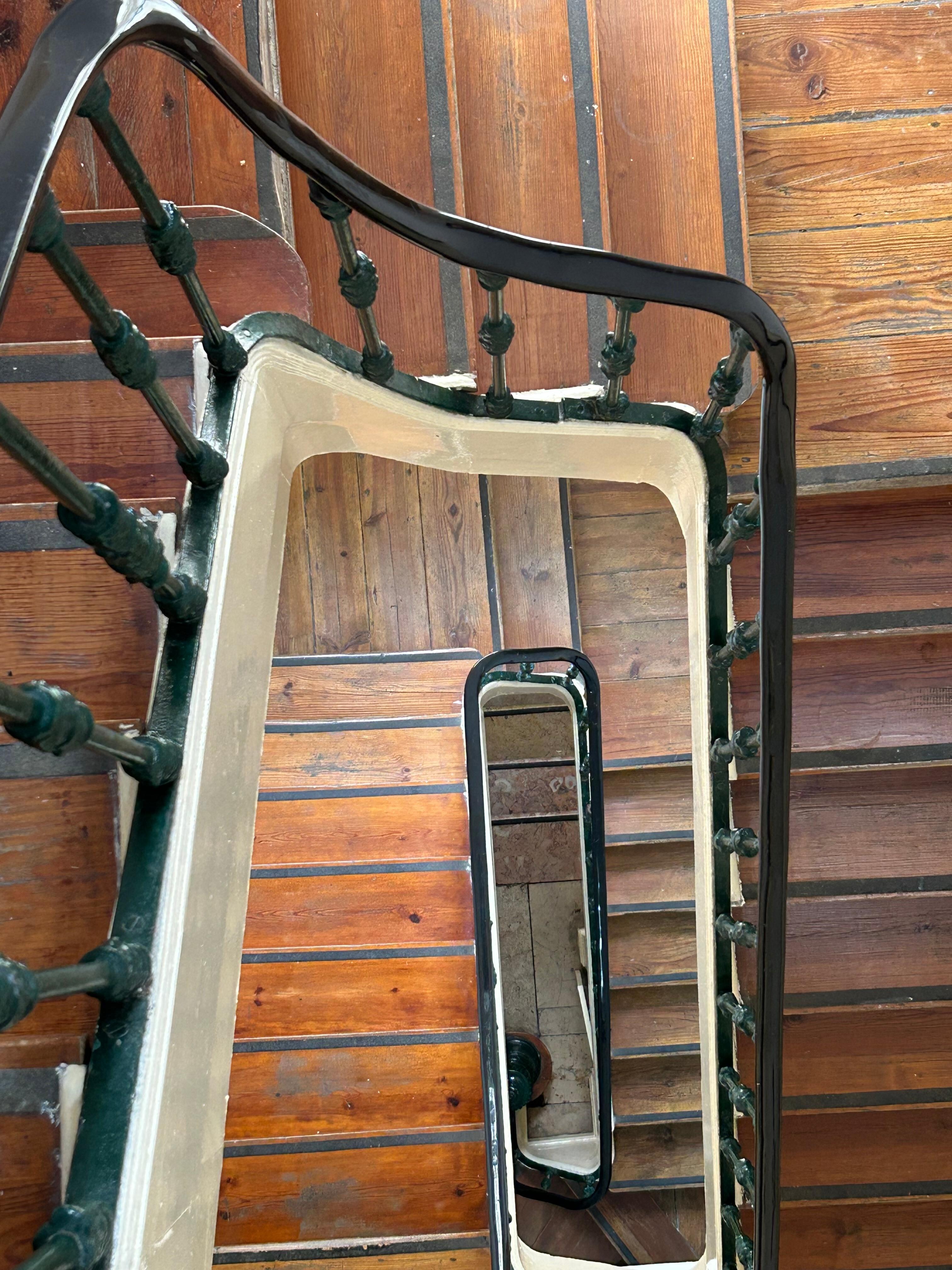 Narrow stair case to top floor.  