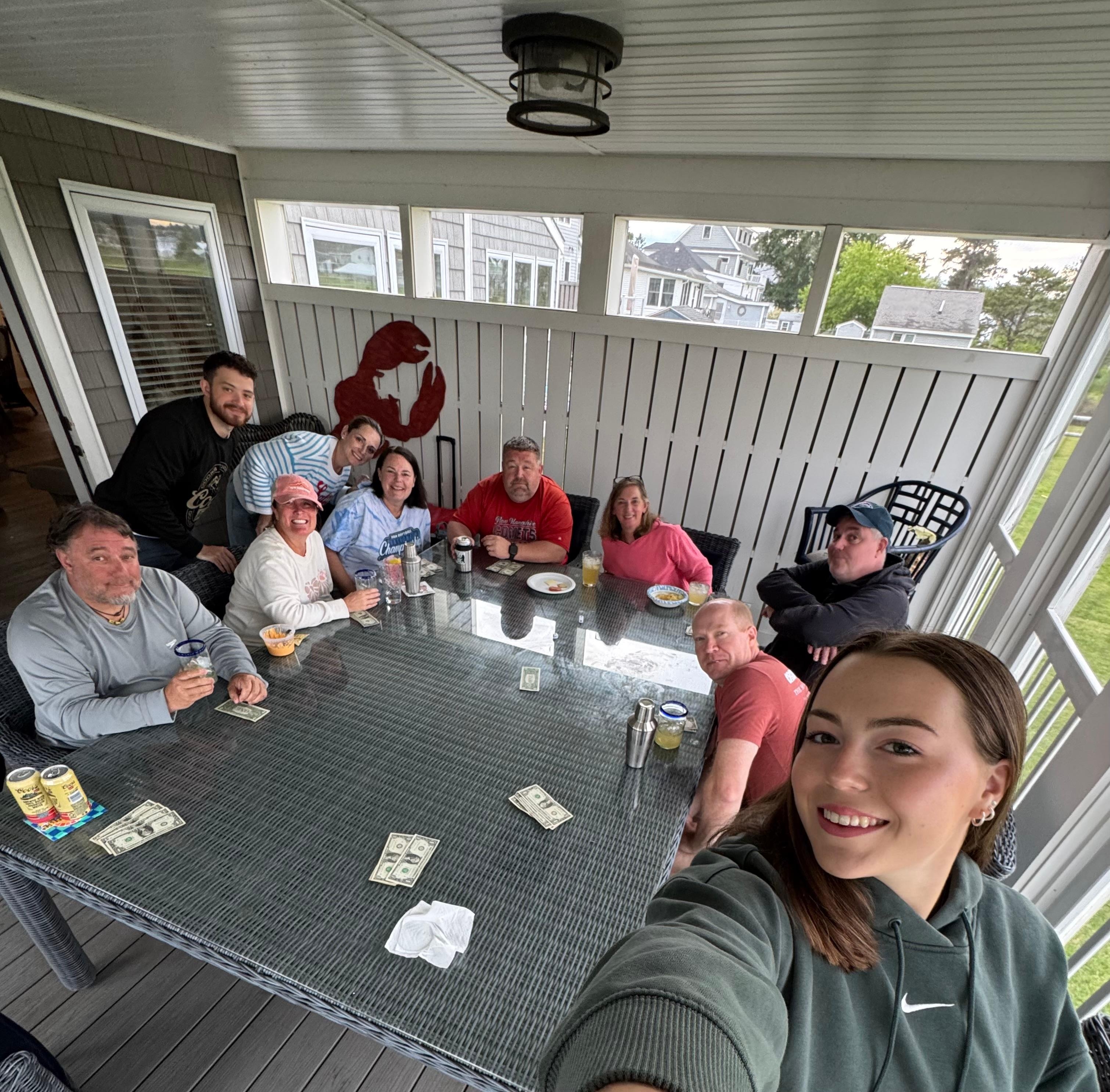 Card games on the screened-in porch at the HUGE table.