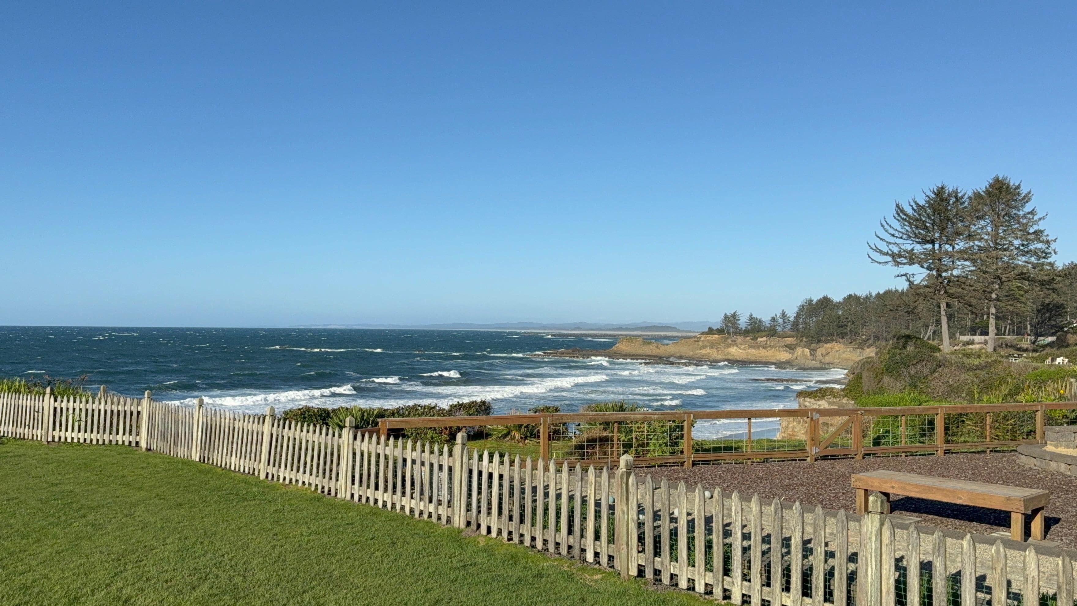 Views overlooking neighboring yard and ocean beyond. 