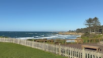 Views overlooking neighboring yard and ocean beyond.