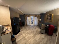 Queen bedroom suite with pullout sofa - garden/pool view.