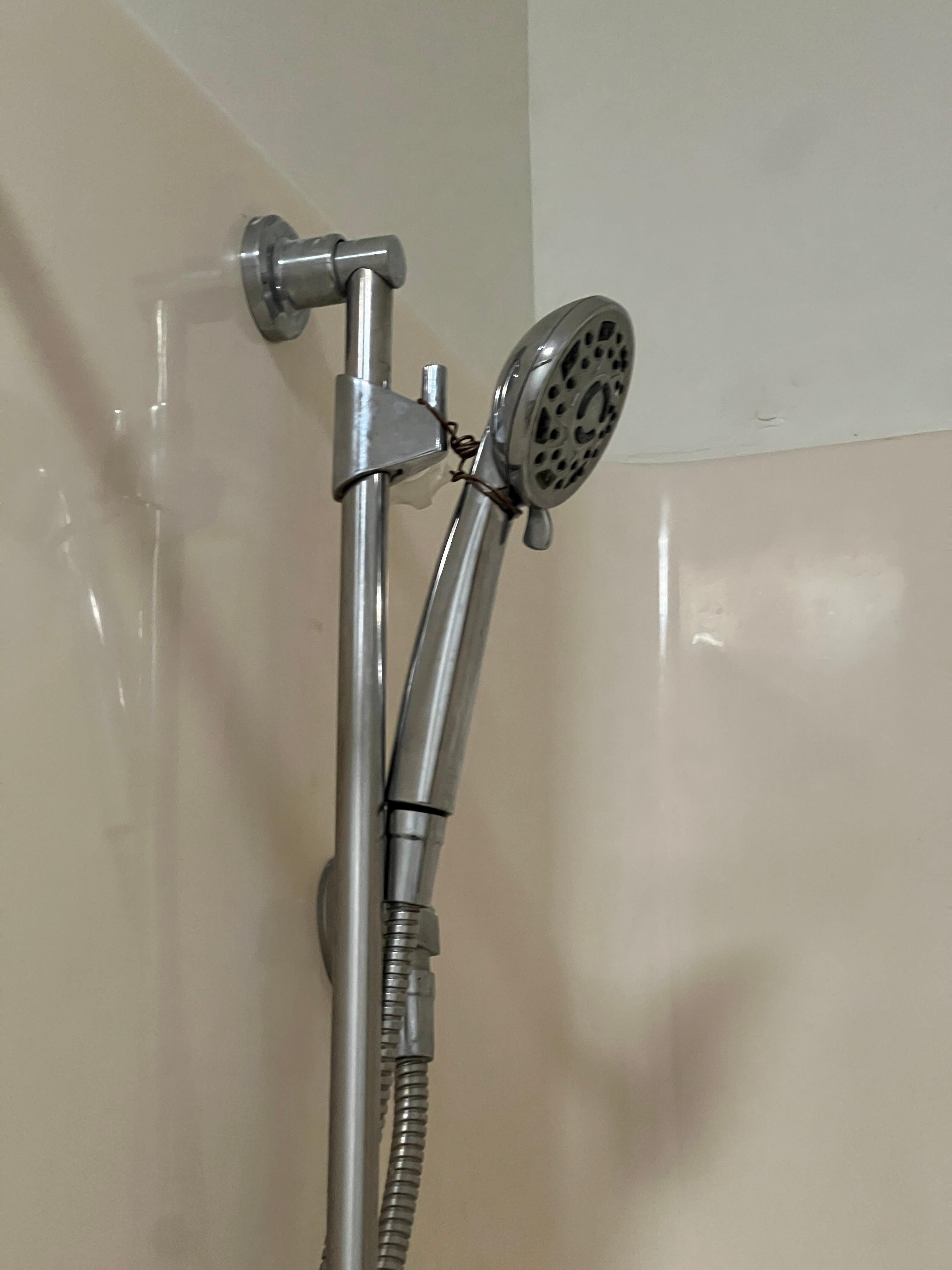 Shower head held by a wire