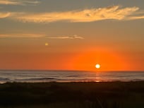 Watching the beautiful sunset from the backyard.