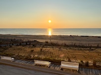 Beautiful balcony view of the sunrise over the ocean.