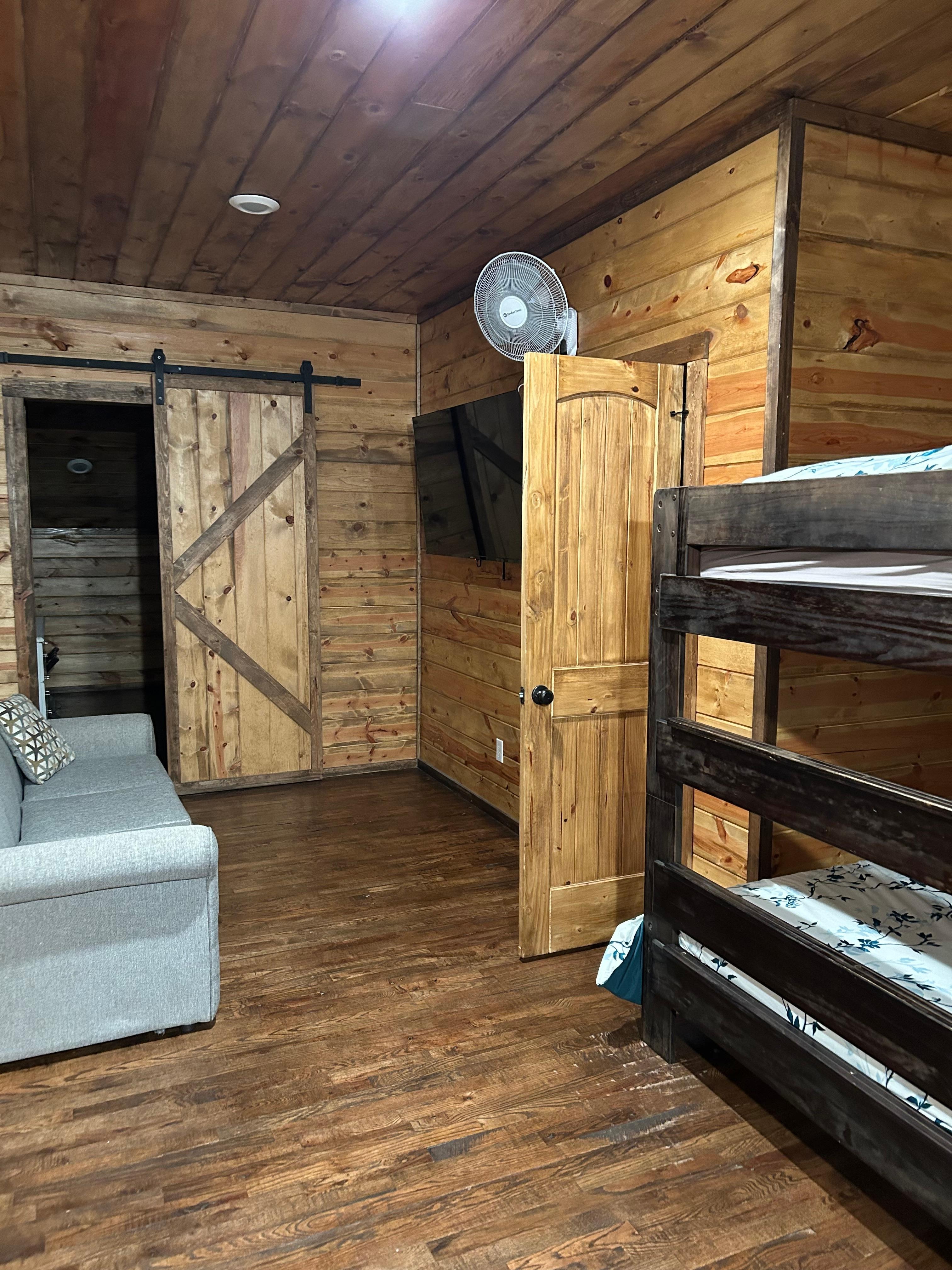 This is a bedroom and that’s the bathroom door.  The sliding door is a second bedroom.  This is the situation on both sides upstairs, except bathroom on other side is open to both bdrms, but you still have to walk through one bdrm to get to through 