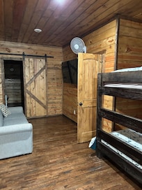 This is a bedroom and that’s the bathroom door. The sliding door is a second bedroom. This is the situation on both sides upstairs, except bathroom on other side is open to both bdrms, but you still have to walk through one bdrm to get to through