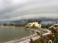 Front porch view of a storm rolling in