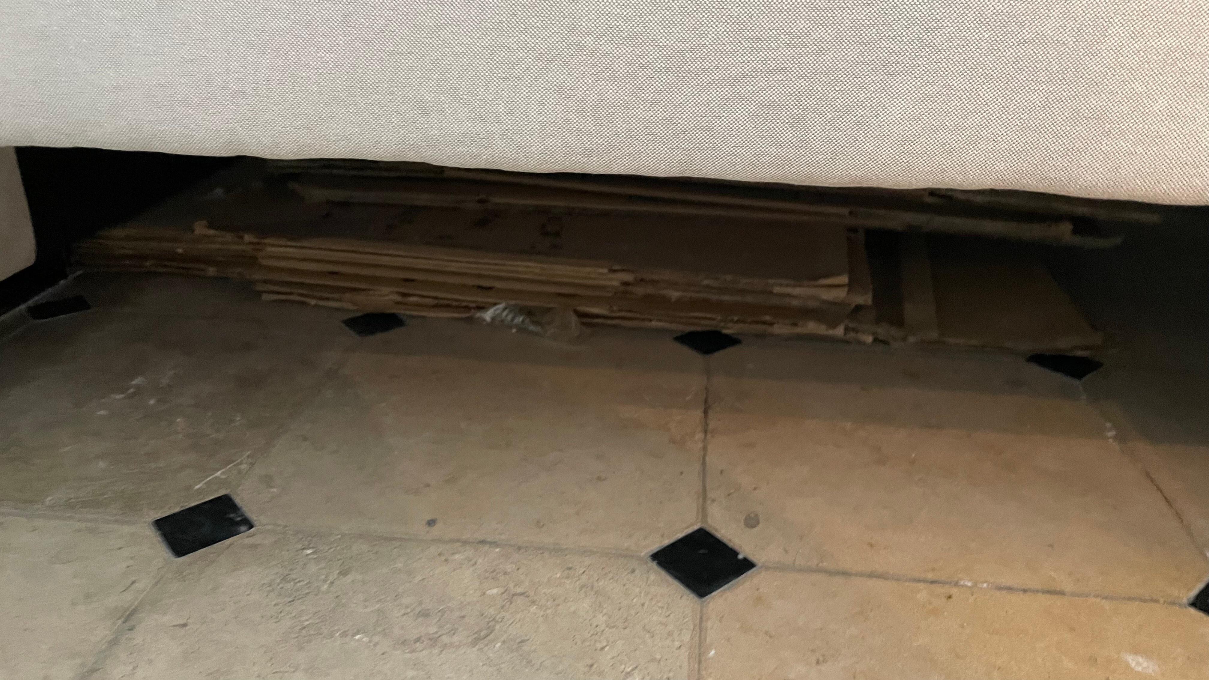 Dusty and garbage under the bed