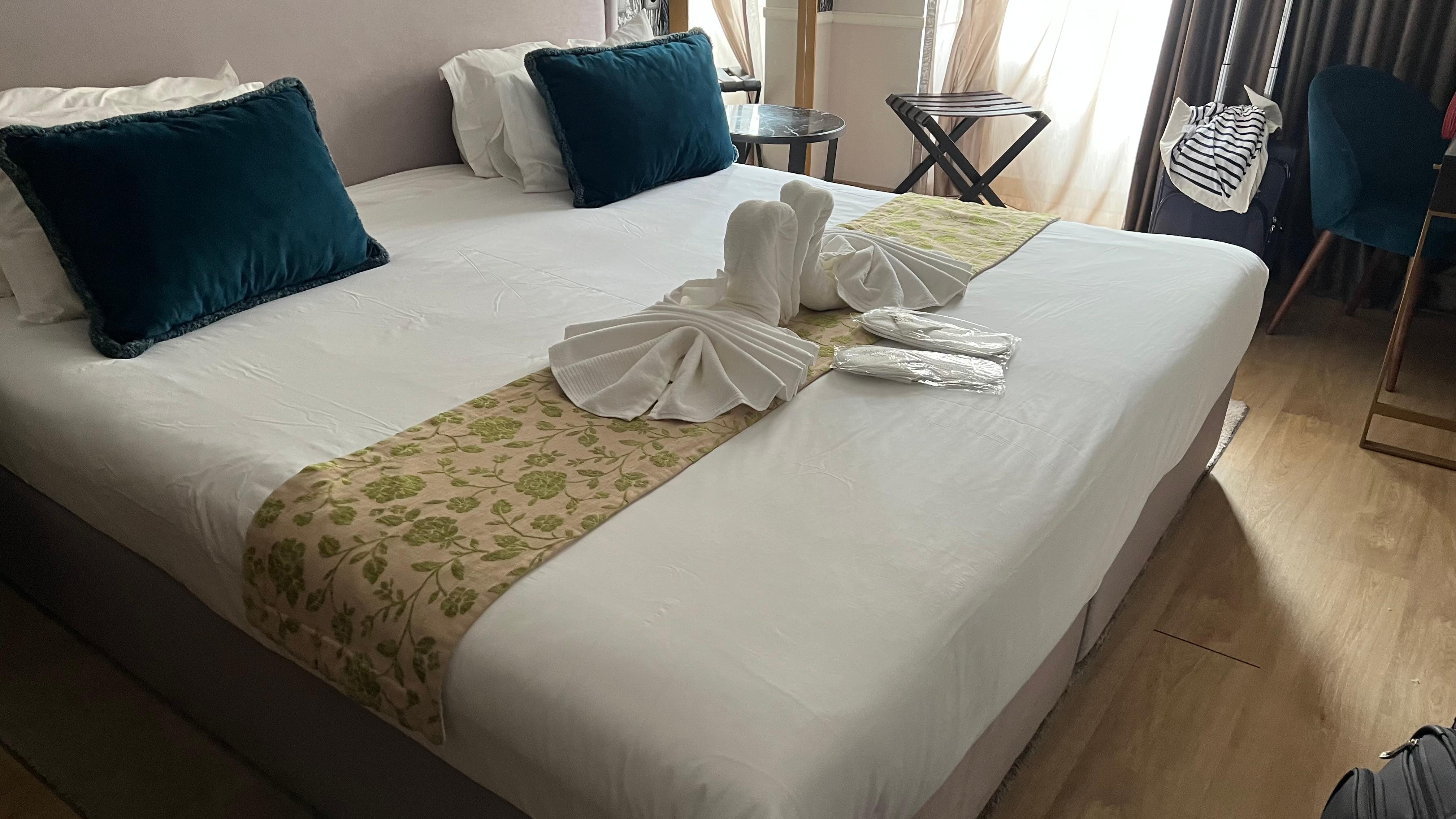 Room always with a nice towel art.