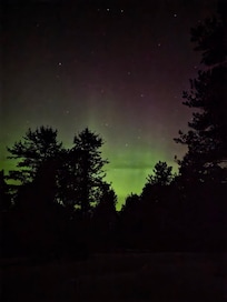 Northern lights view from outside home.