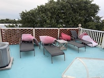 Faded, Dirty, Ripped Cushions on Rooftop